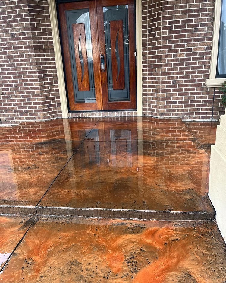 A kitchen with a marble floor and a black island