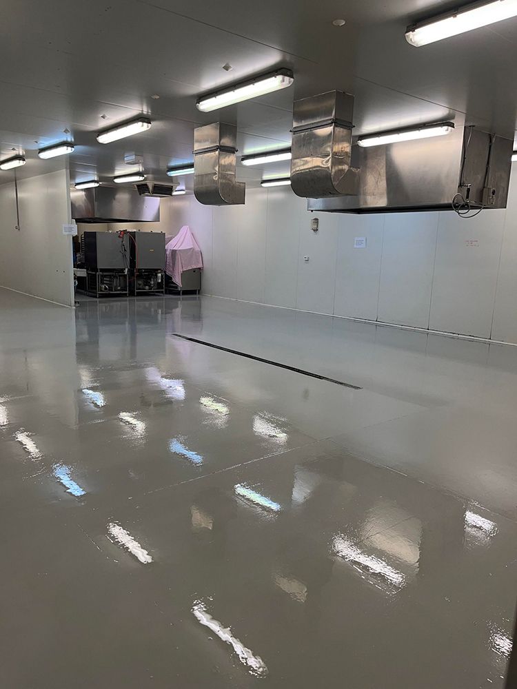 It is a very large room with a lot of lights on the ceiling