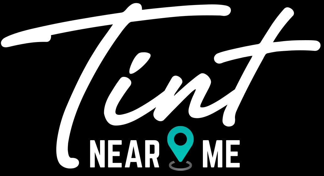 The logo for tint near me is white on a black background.