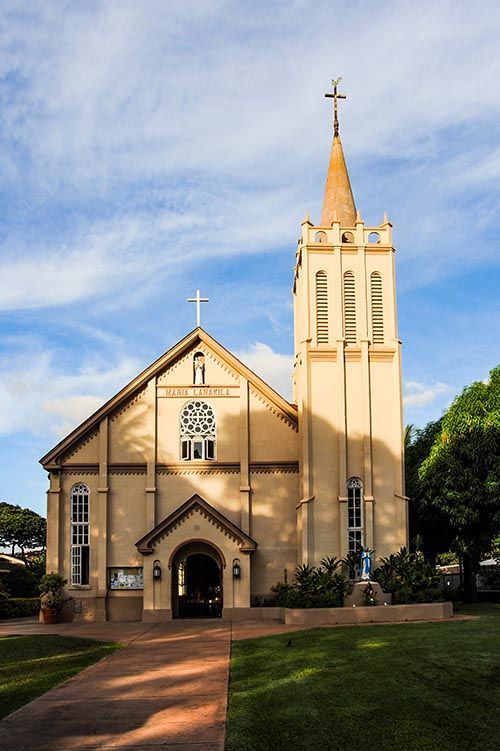 A church with a steeple and a cross on top