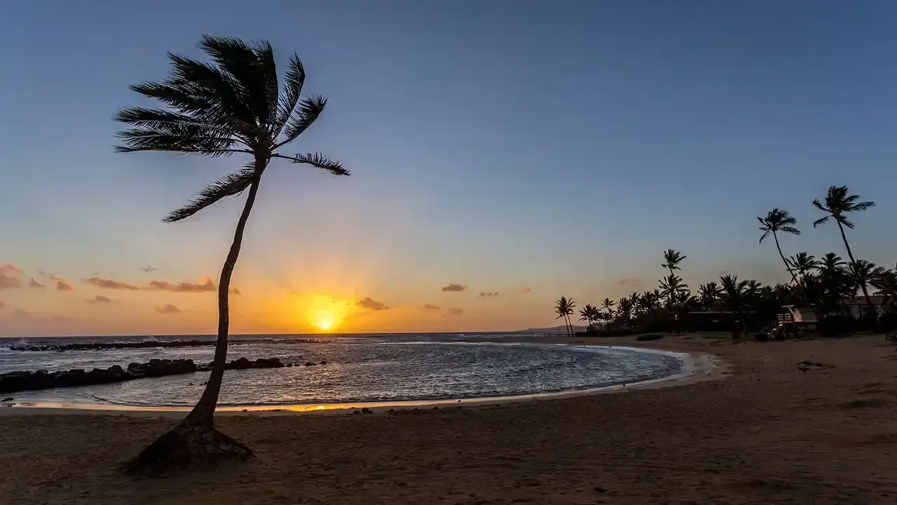 Sunset on Poipu Beach, Kauai, Hawaii.