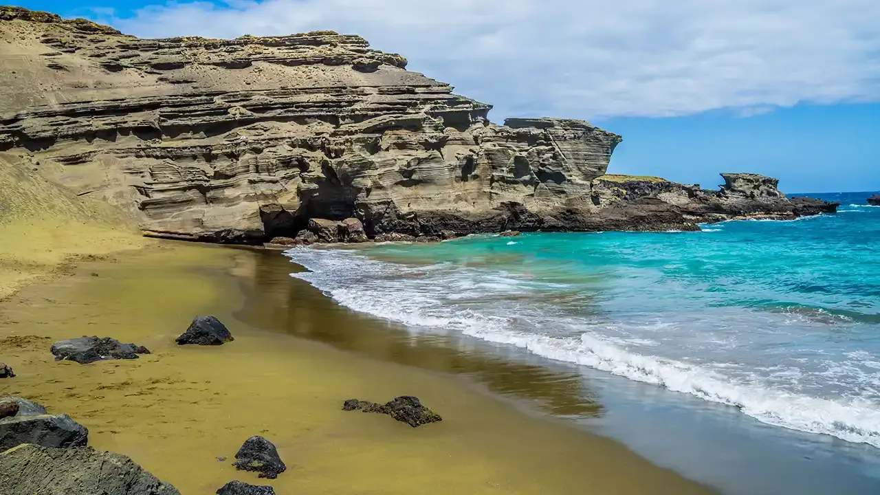 Papakolea Green Sand beach on the Big Island of Hawaii is a must visit beach during your Hawaiian vacation.