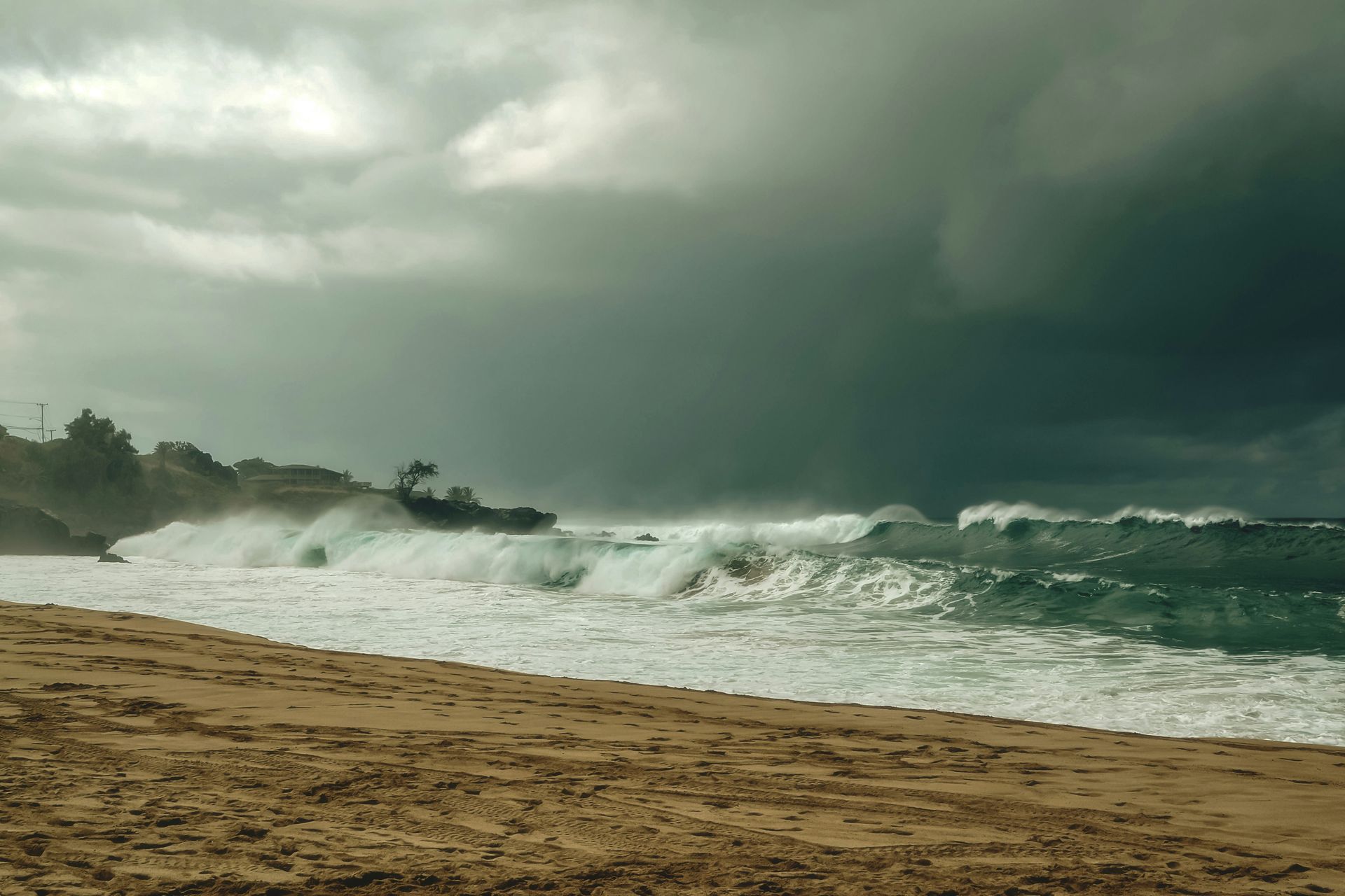 a big dark storm rolling in off the shore of waimea hawaii