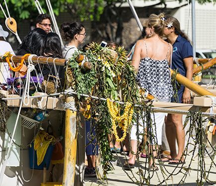 Lei draped on the railing say, 