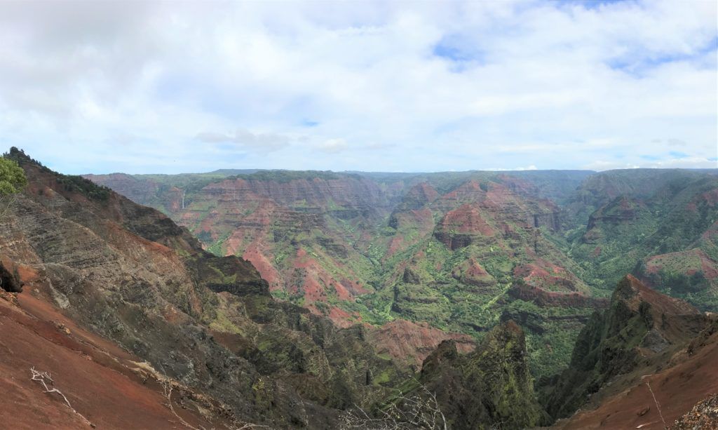 A view of a canyon from the top of a mountain.