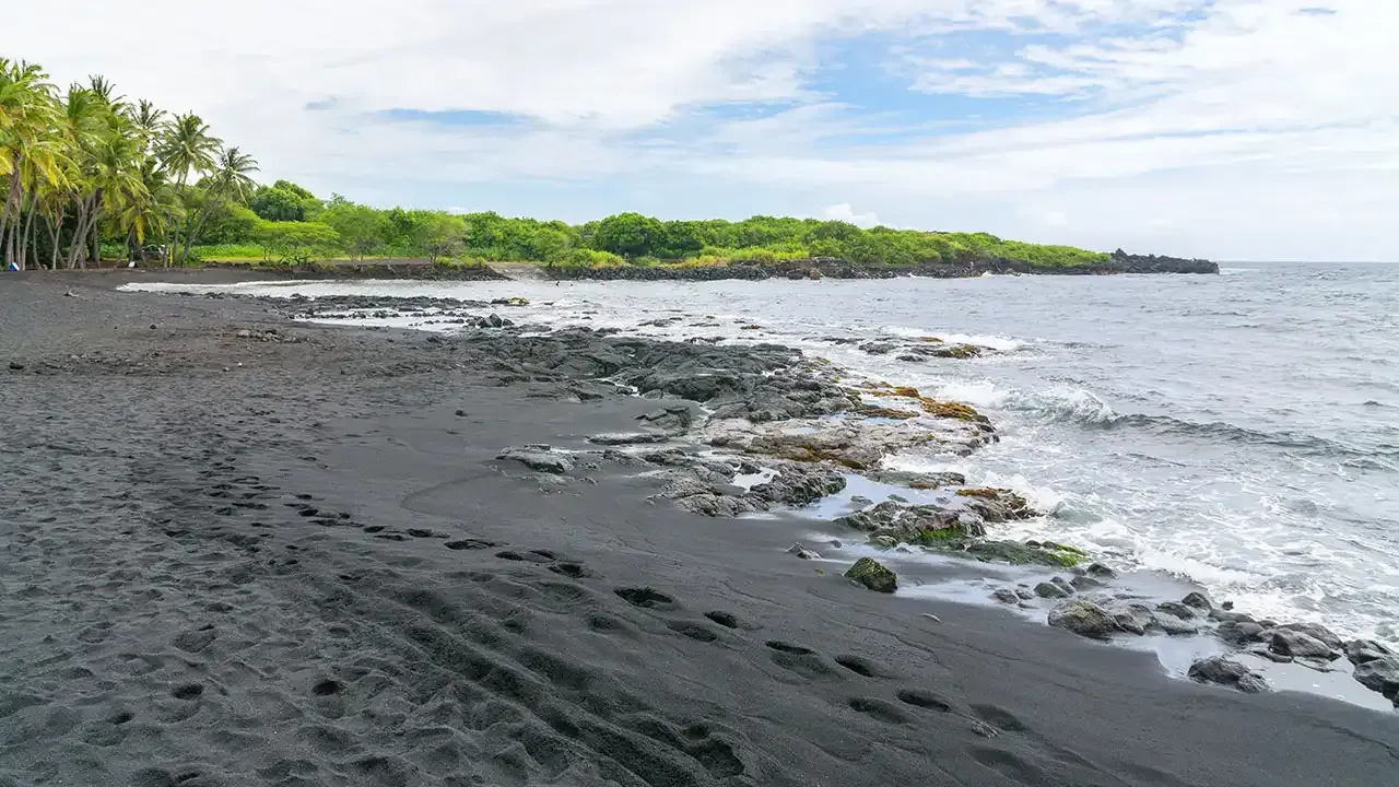 Discover why Punaluu Black Sand Beach on the Big Island of Hawaii should be on your bucket list.
