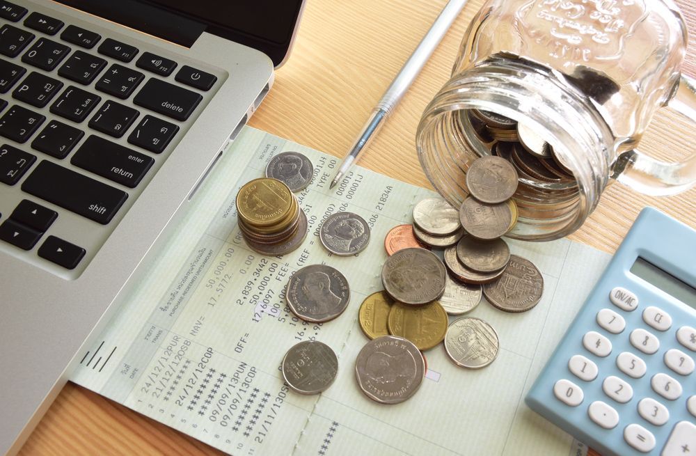 Coins And Laptop — Financial Advisor In Dubbo