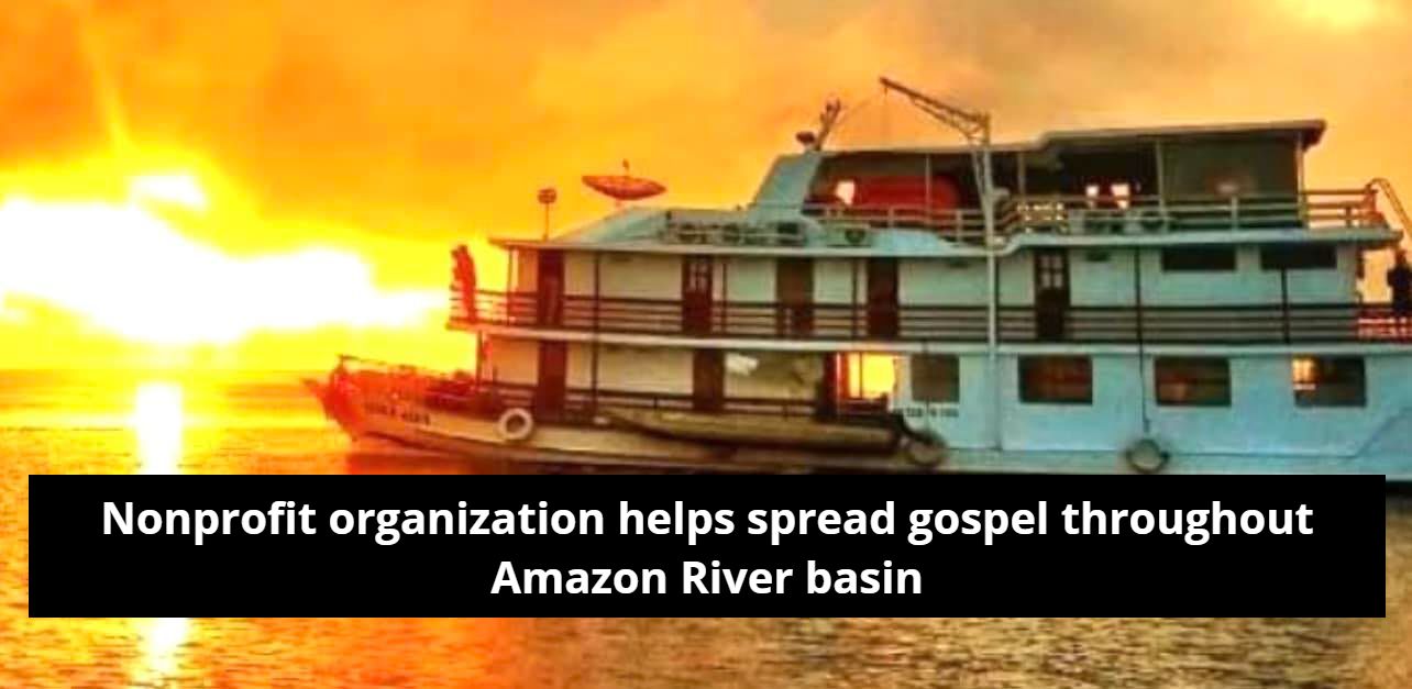 A boat is floating on top of a body of water at sunset.
