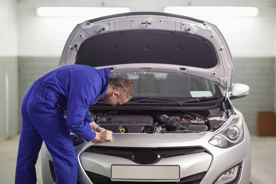 Man Fixing the Engine of the Car  - Car maintenance in Baytown, TX
