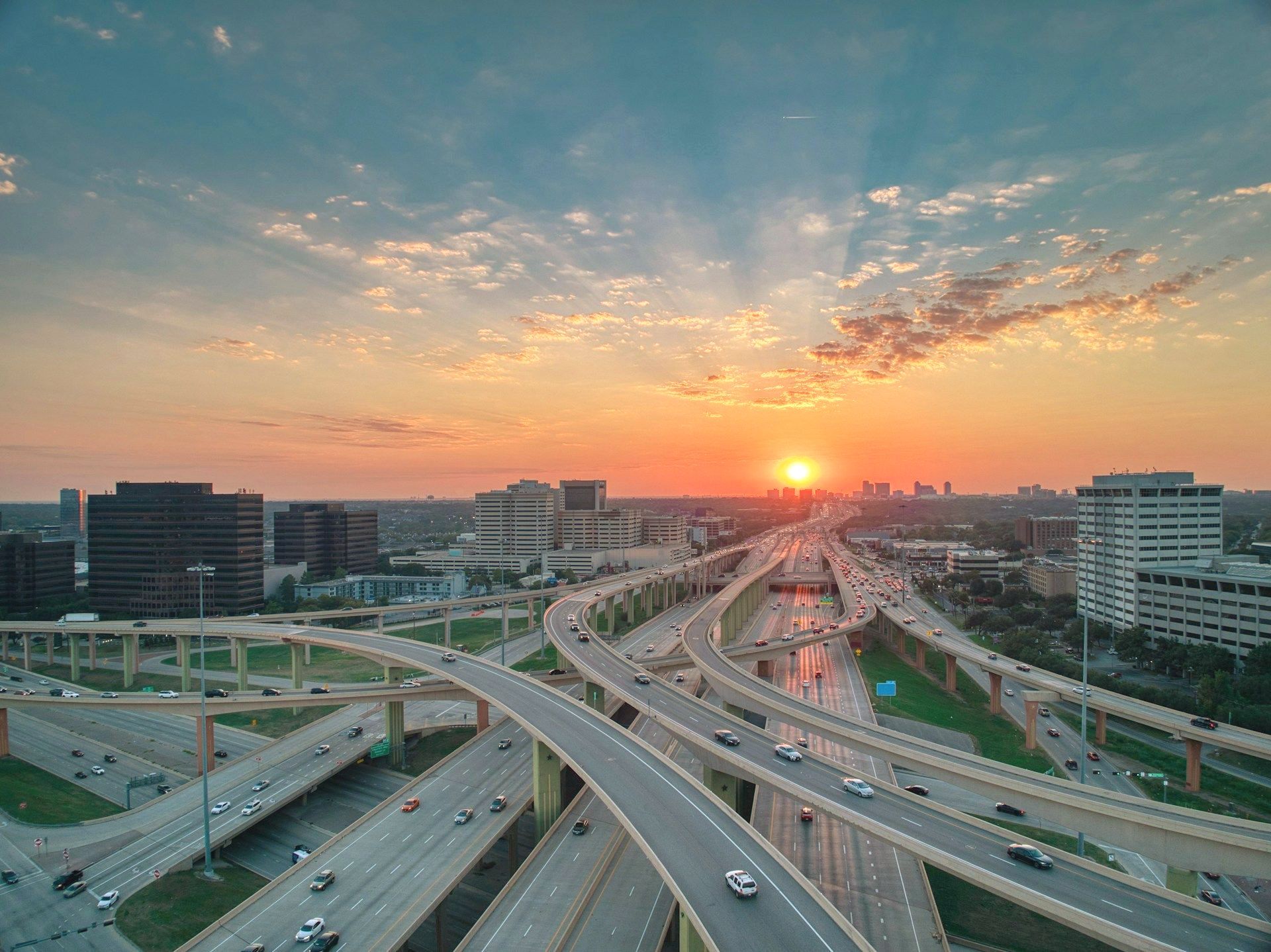 A dirt road lined with trees on both sides.