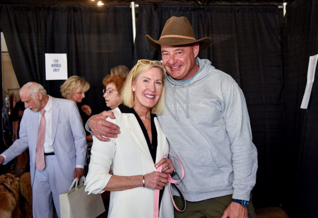 Couple enjoying the Derby themed therapy pets and models