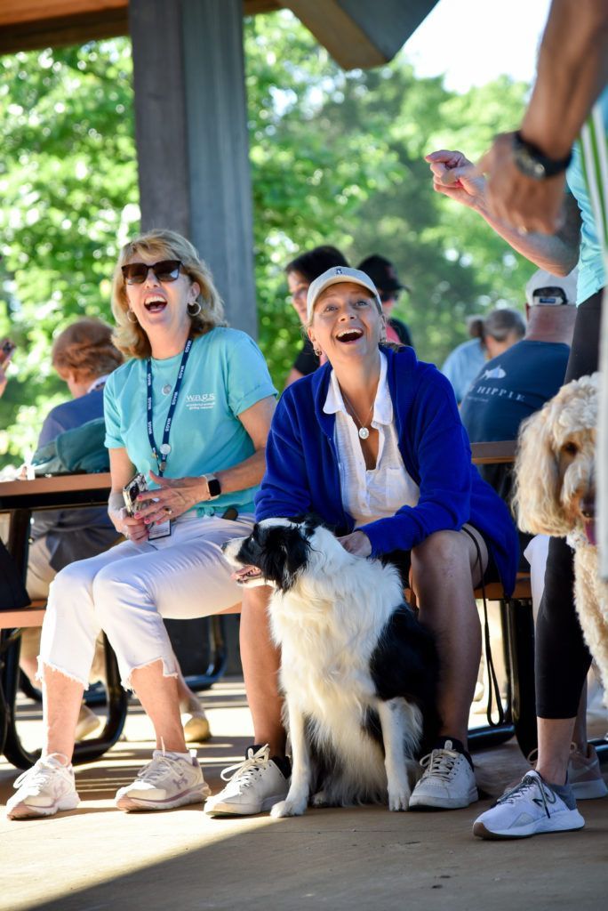 Fun in fundraising for 2 WAGS participants, laughing with Border Collie