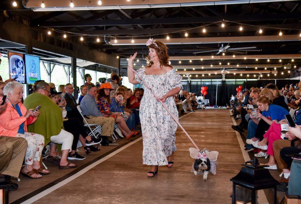 Both model and small pet are dressed as angels