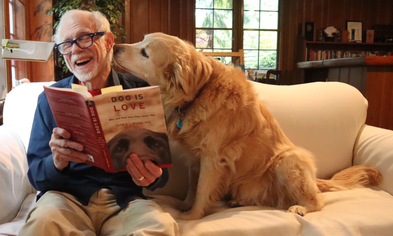 Buddy and Millie reading on the couch