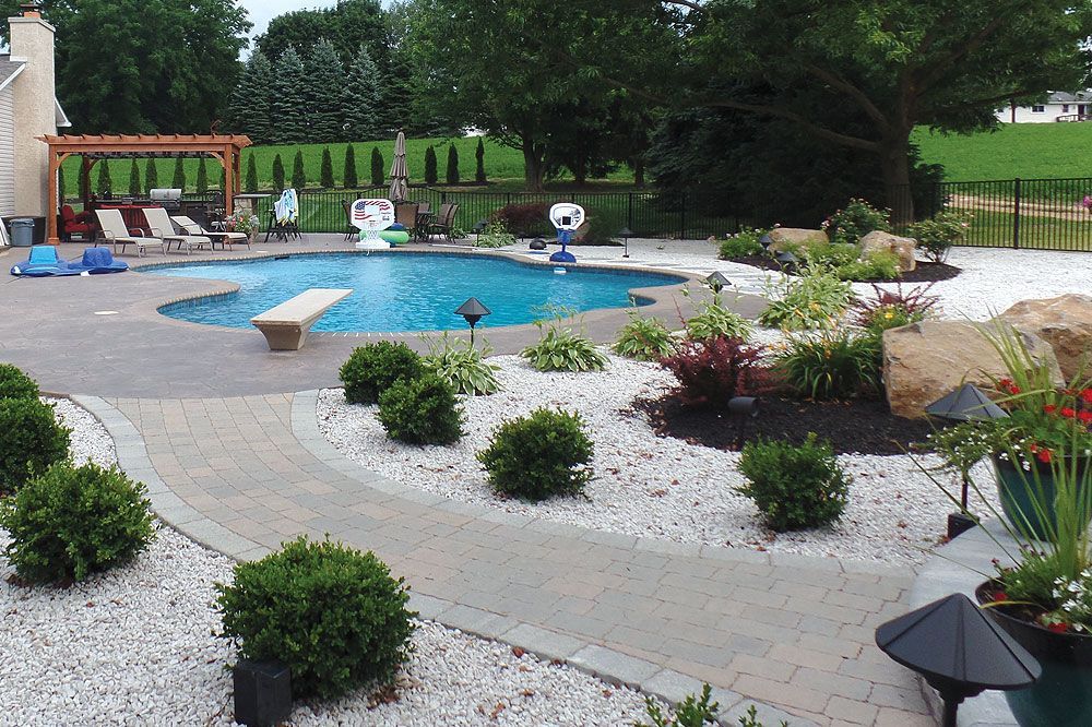 A skilled construction worker carefully placing bricks in a masonry wall using a trowel.