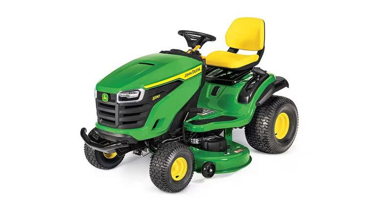 A green and yellow John Deere S130 riding lawn mower viewed from the front-right against a white background.