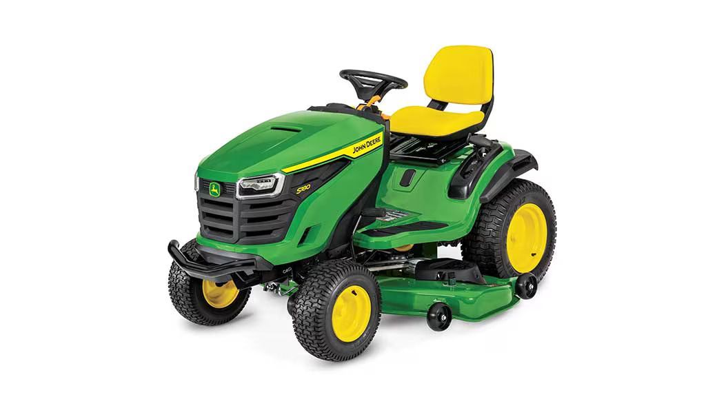 A John Deere S180 riding lawn mower with a green hood, yellow seat, and black tires against a white background.