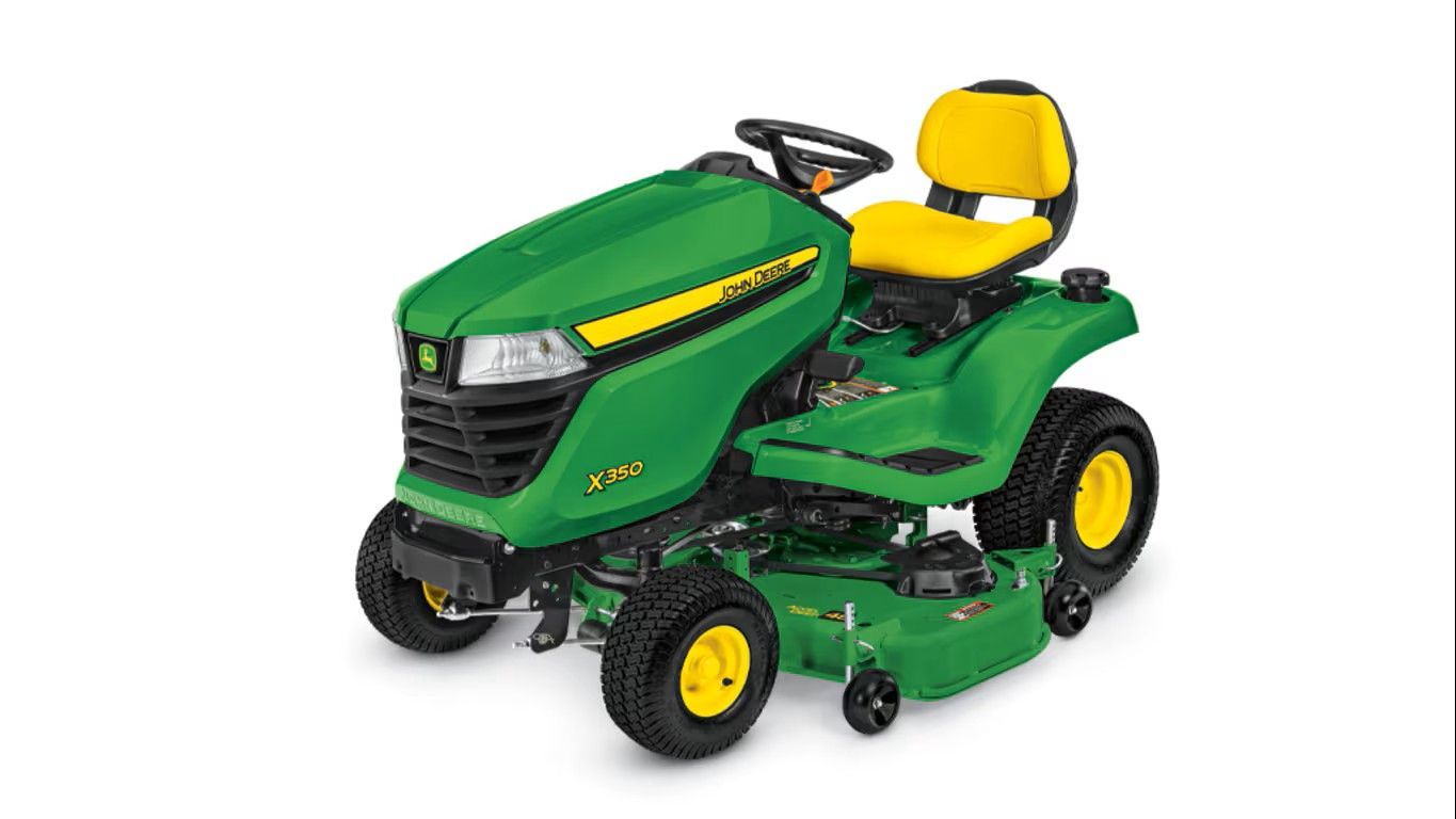 A green and yellow John Deere Z325E zero-turn riding lawn mower on a white background.