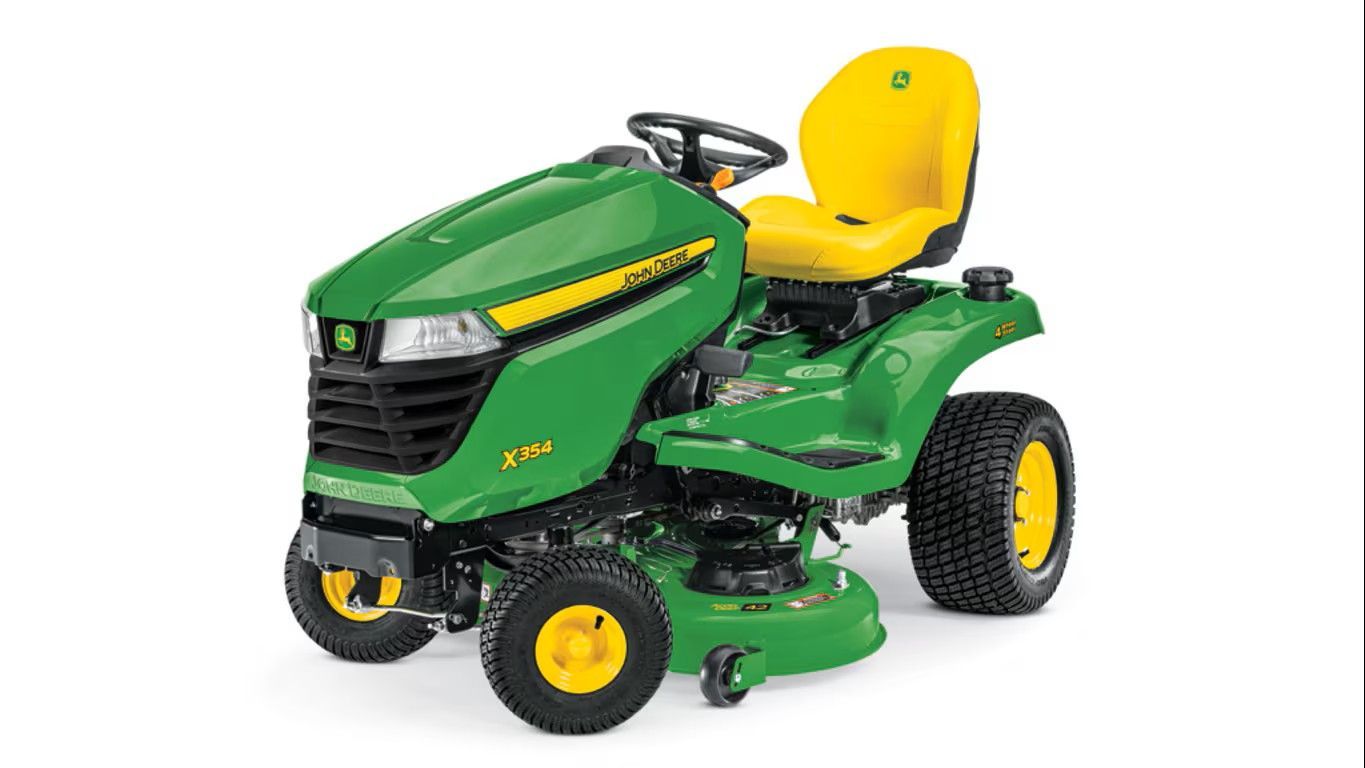 A green and yellow John Deere Z330R zero-turn riding lawn mower on a white background.