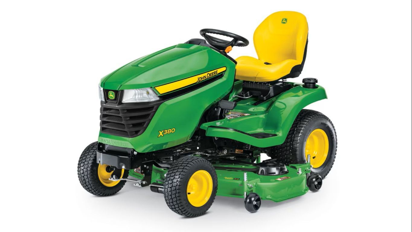 A green and yellow John Deere Z330R zero-turn riding lawn mower on a white background.