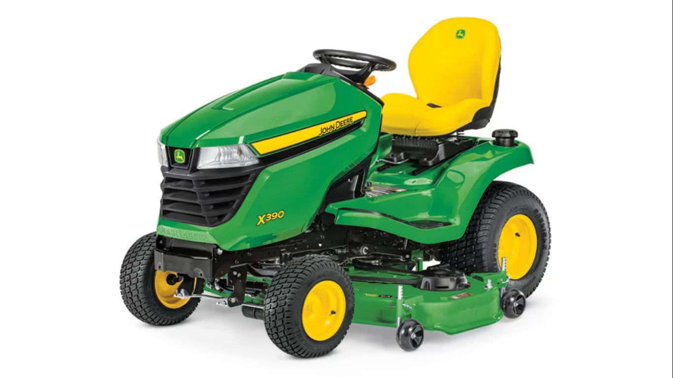 A green and yellow John Deere Z330R zero-turn riding lawn mower on a white background.