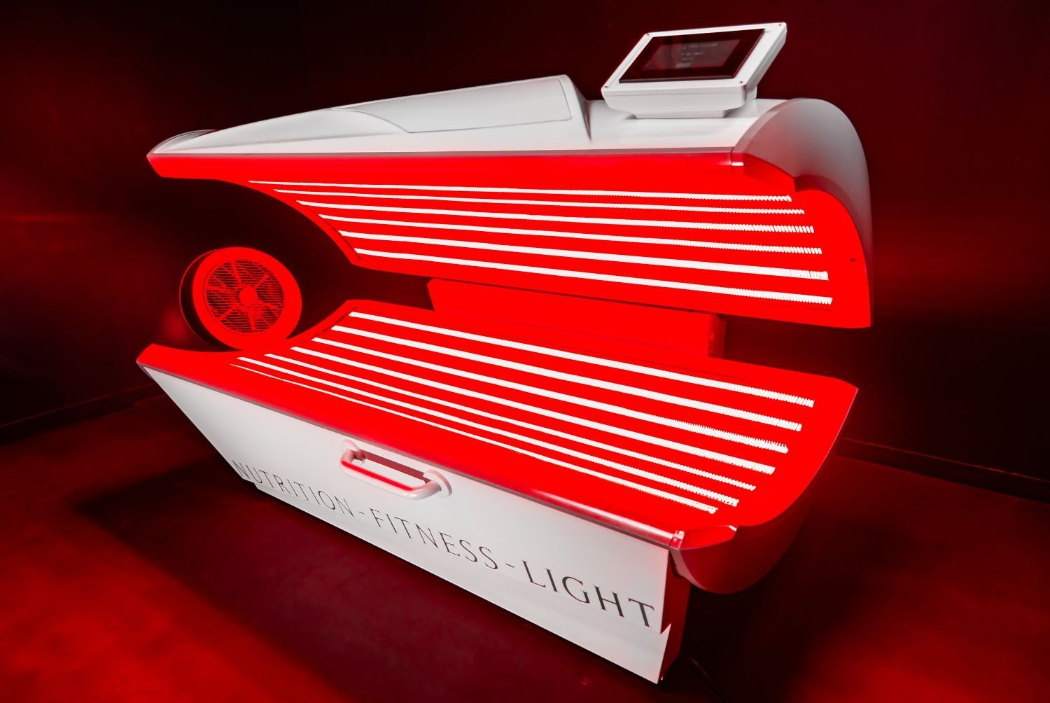 Red light therapy machine. White and red, appears to be designed for fitness.