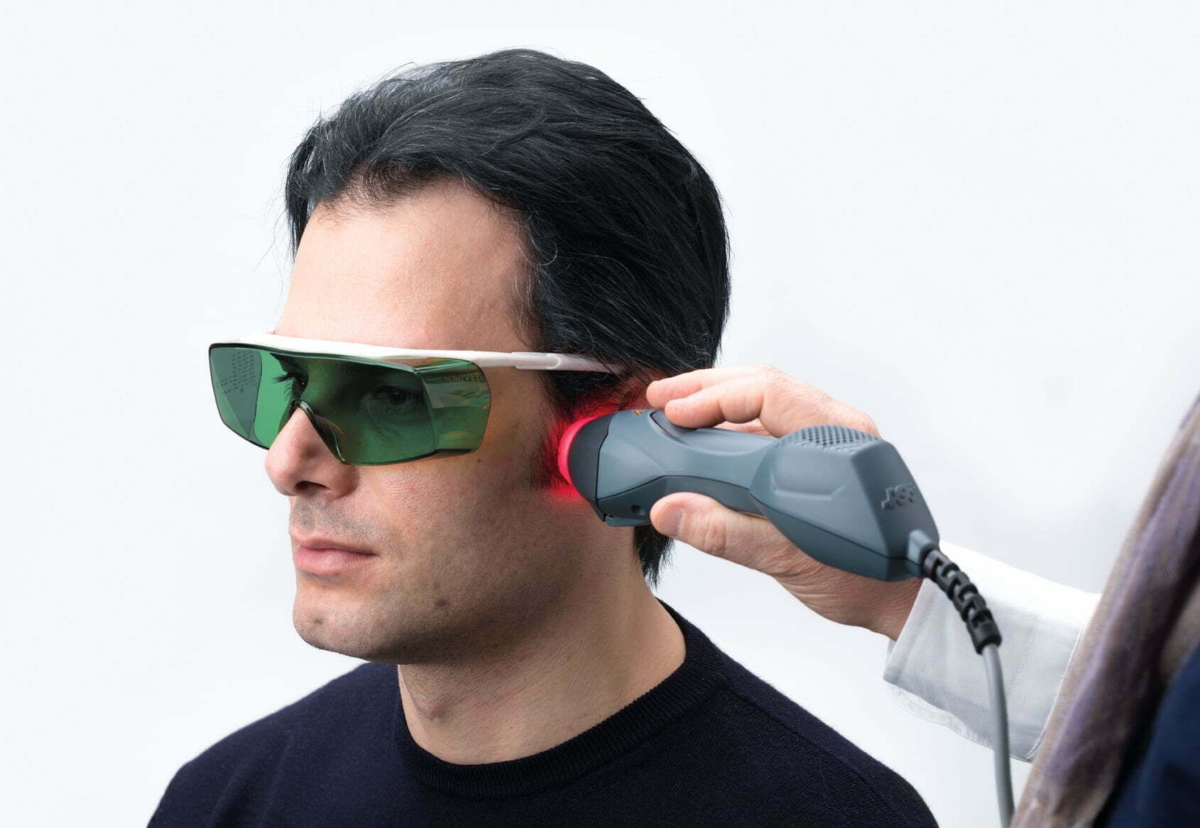 Exterior of a business with glass doors and a sign that reads 