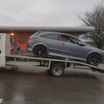 Car being collected by tow truck