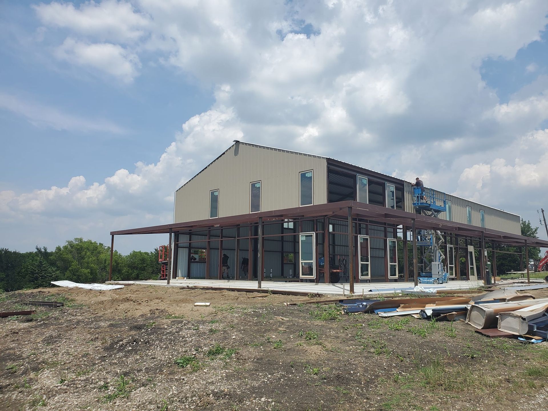 Family gathered at a dining table in a kitchen. They are eating and talking together.