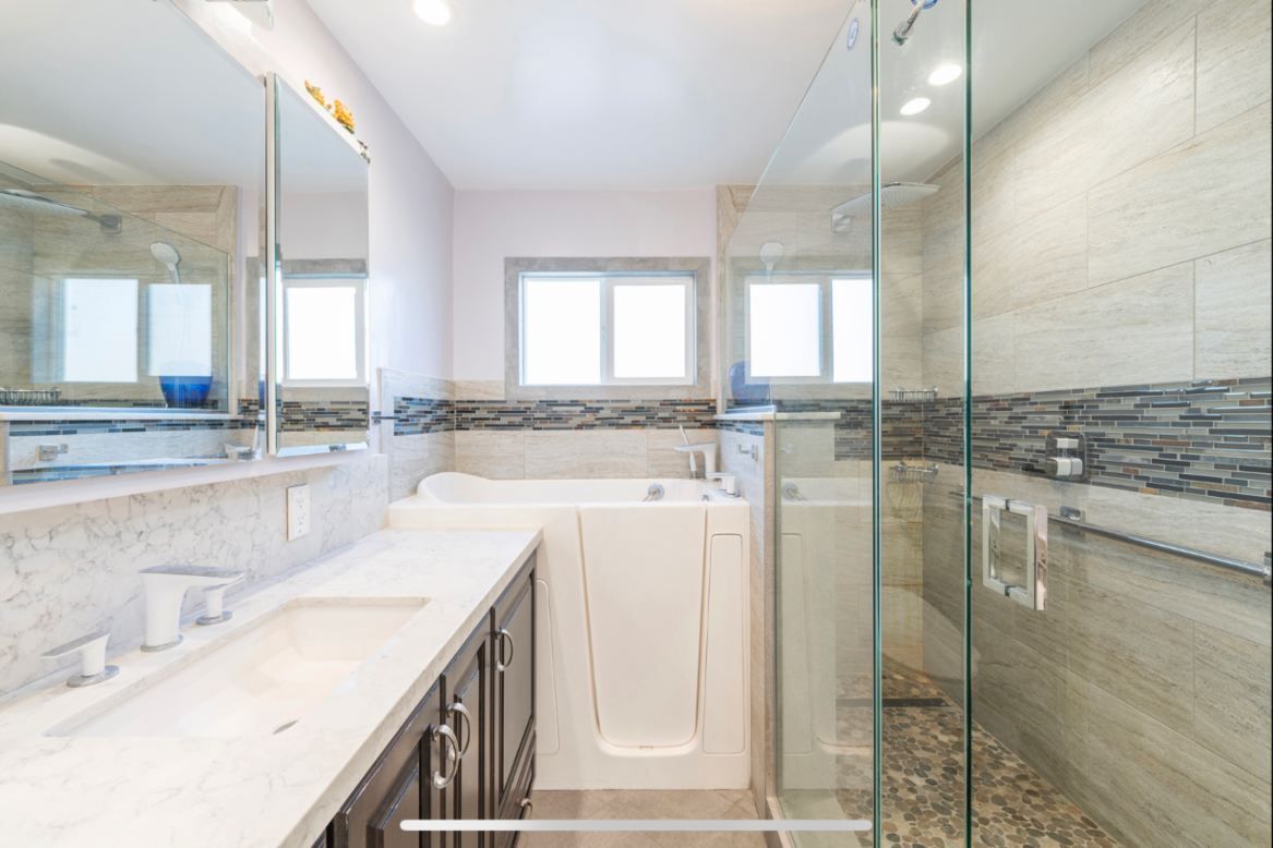 Bathroom with walk-in tub, glass shower, long vanity. Designed for accessibility. Assisted Living in Lomita, CA.