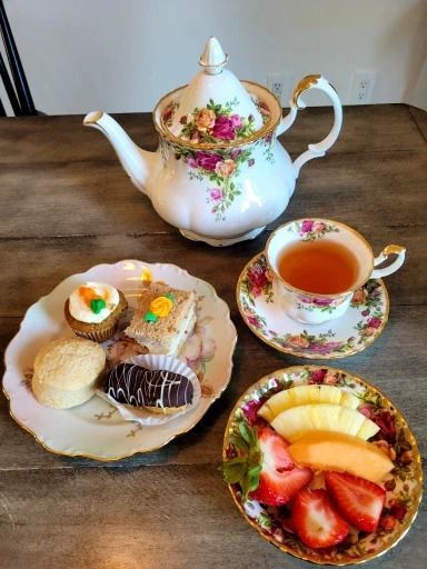 Tea set with pastries and fruit on a wooden table. Pepper Tree Assisted Living in Lomita, CA.