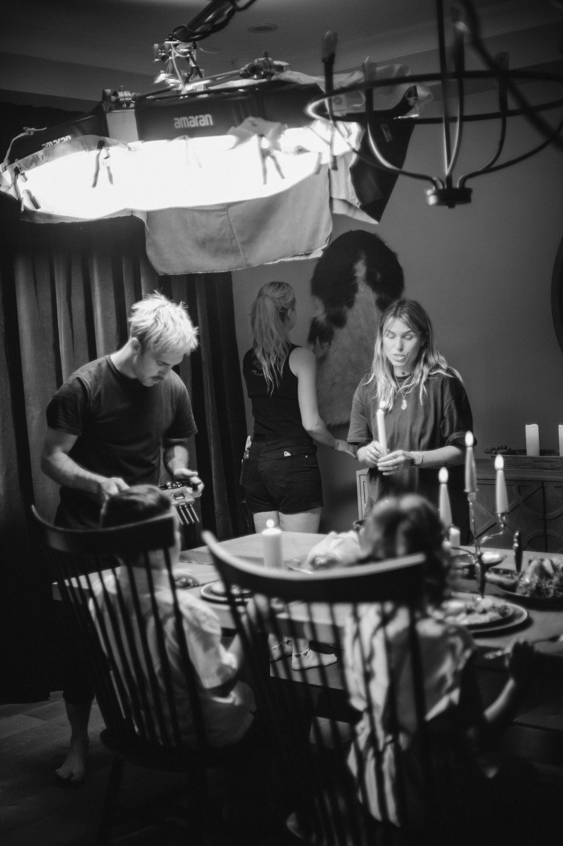 A man is playing a guitar in a black and white photo