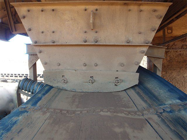 a conveyor belt in a factory with the number 18 on it - mistracked belt