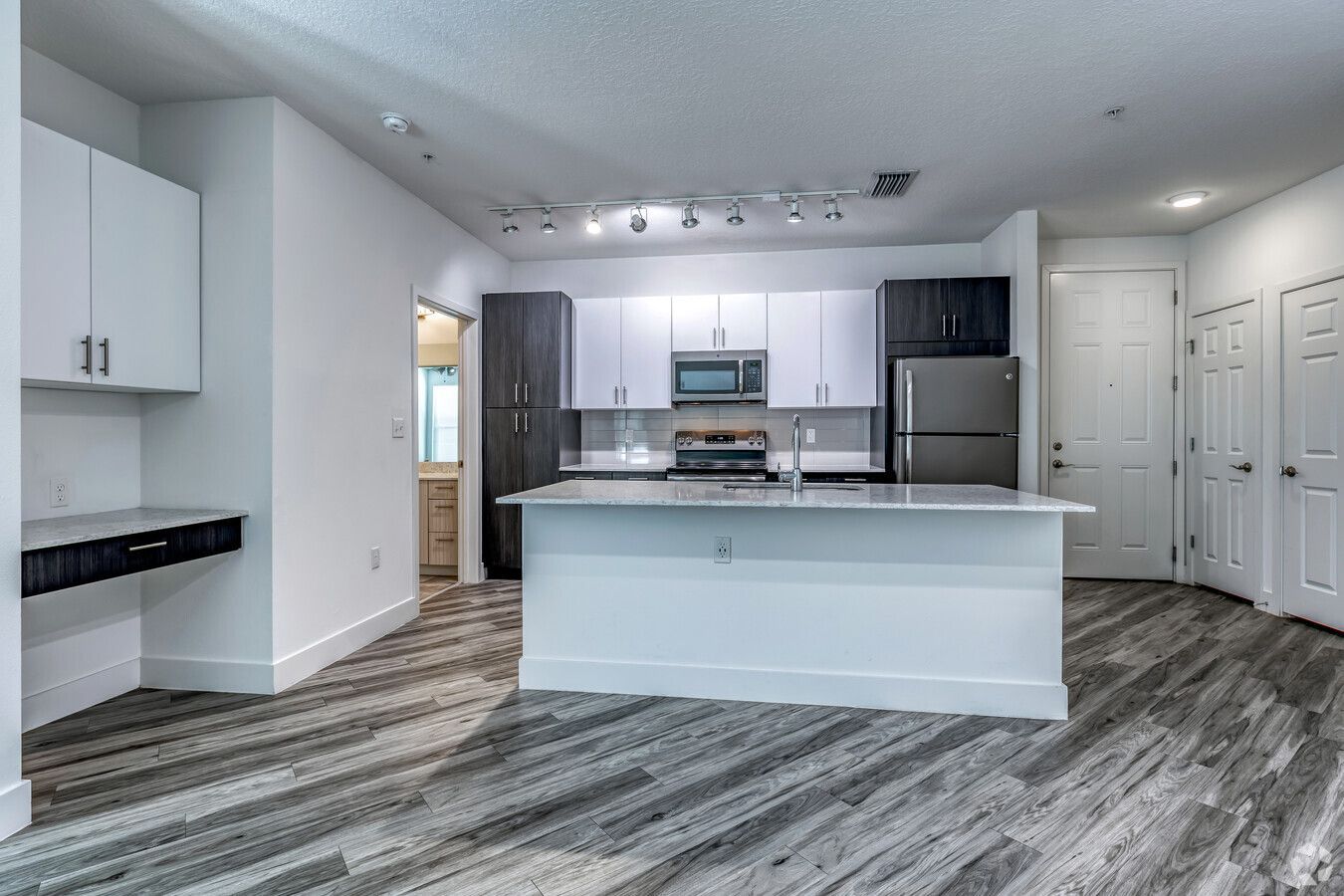 There is a large island in the middle of the kitchen.
