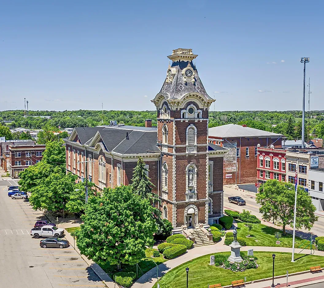 Historic brick courthouse with ornate tower, seen from above on a sunny day.