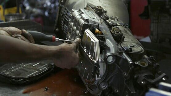 Mechanic giving a car auto transmission service in Randolph, NJ