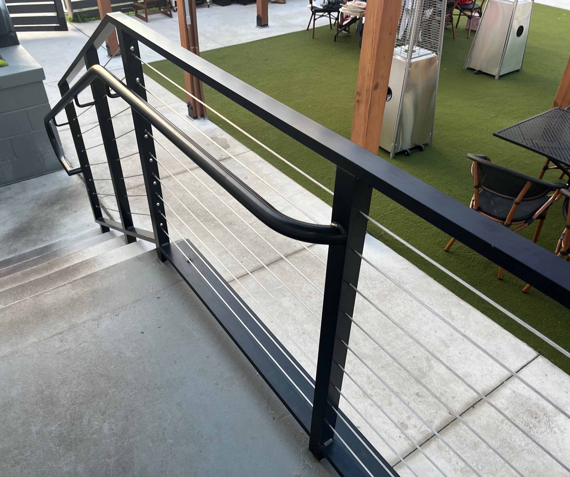 ultra-modern cable railings along stairs and walkway at new trendy restaurant
