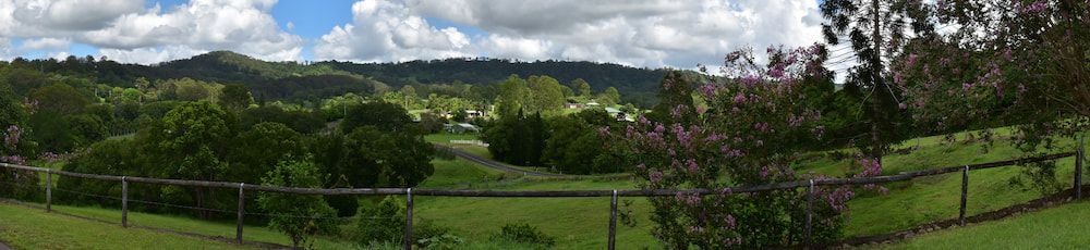 A Person is Cleaning the Filter of an Air Conditioner — Davies Refrigeration & Air Conditioning in Nambour, QLD