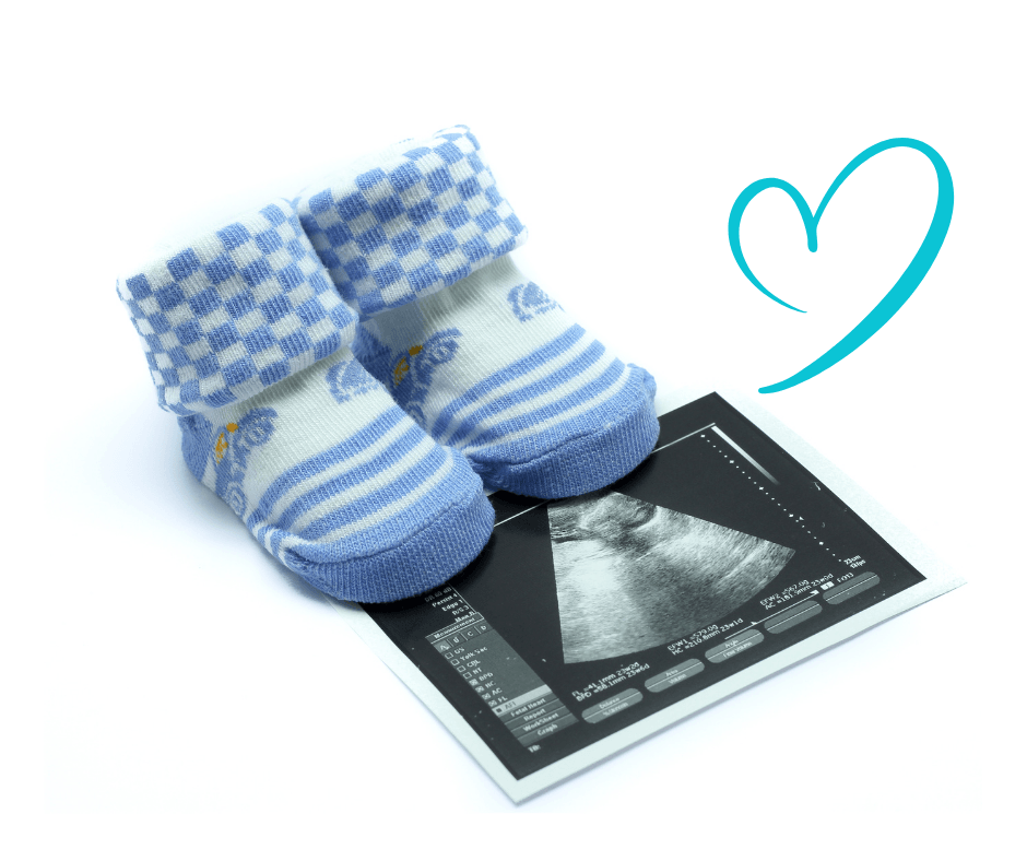 baby ultrasound with blue booties and hand drawn heart