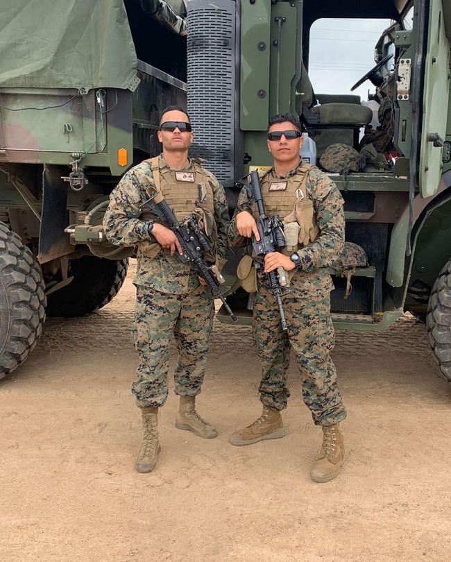 Joe and Dylan in military fatigues
