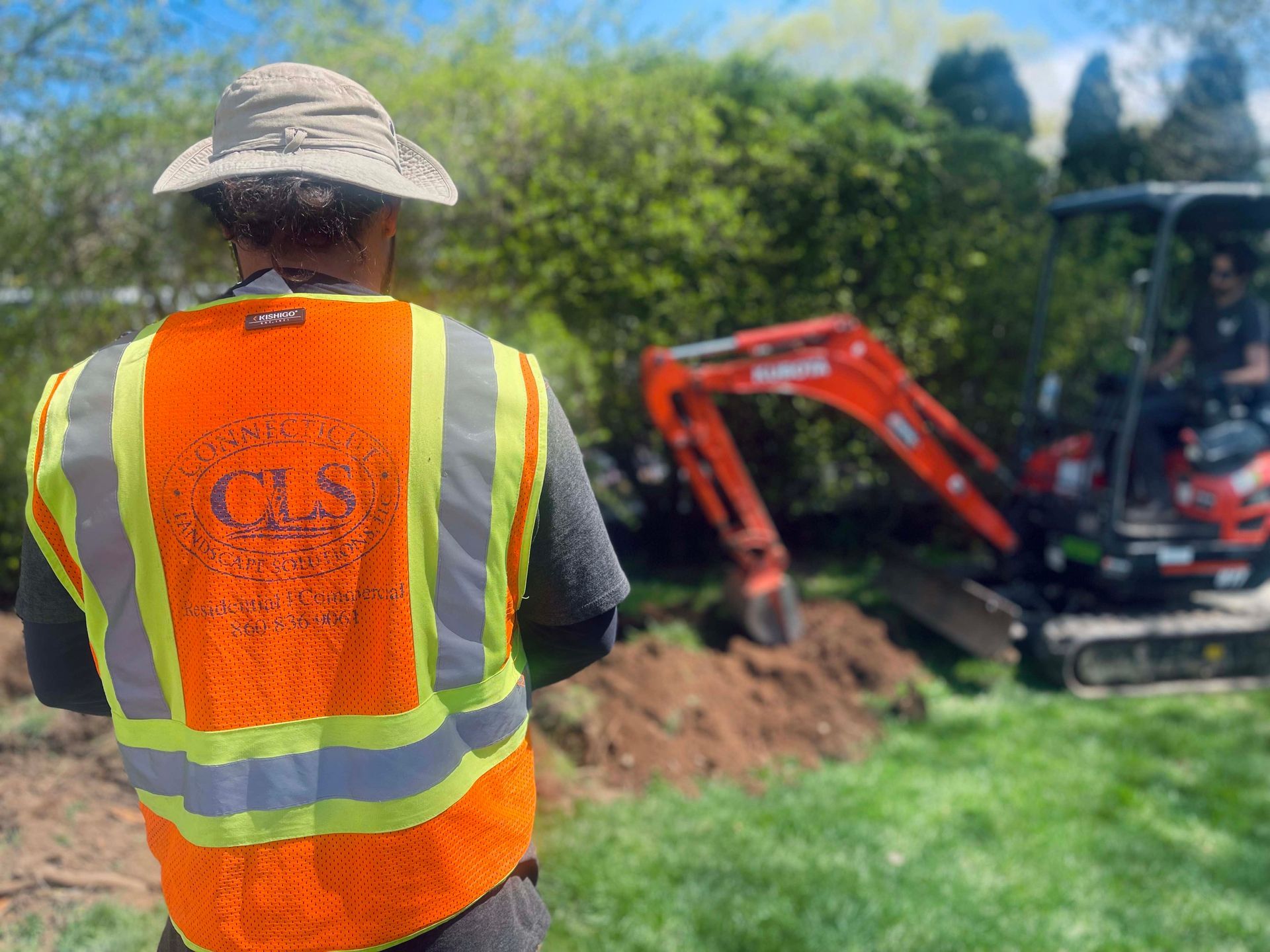 Excavator doing Gutter Drainage Job in West Hartford, Connecticut Landscape Solutions