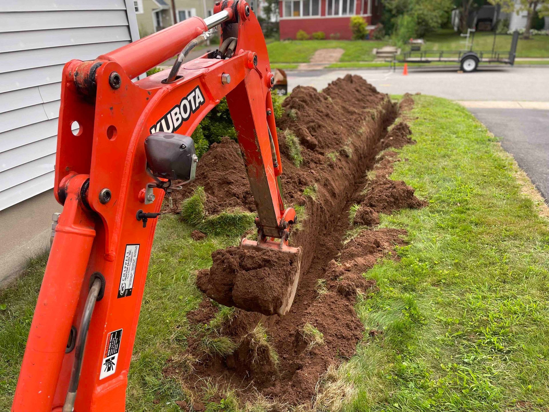 Mini Excavator Trenching Residential Drainage Job in West Hartford, Connecticut Landscape Solutions