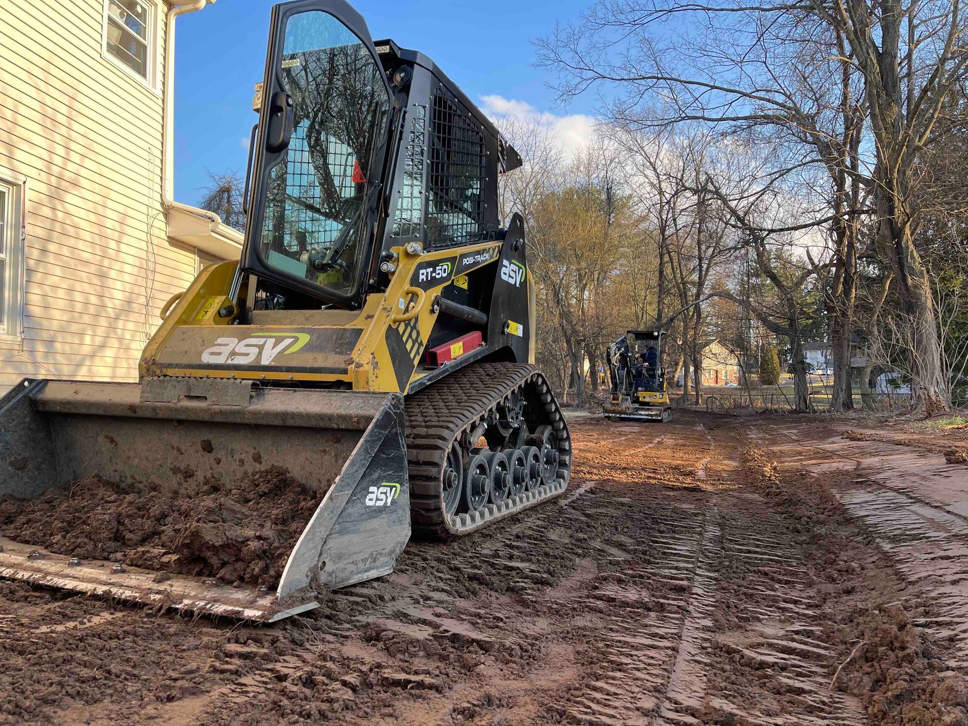 Grading Property to create Swale for proper foundation drainage in West Hartford, Connecticut Landscape Solutions