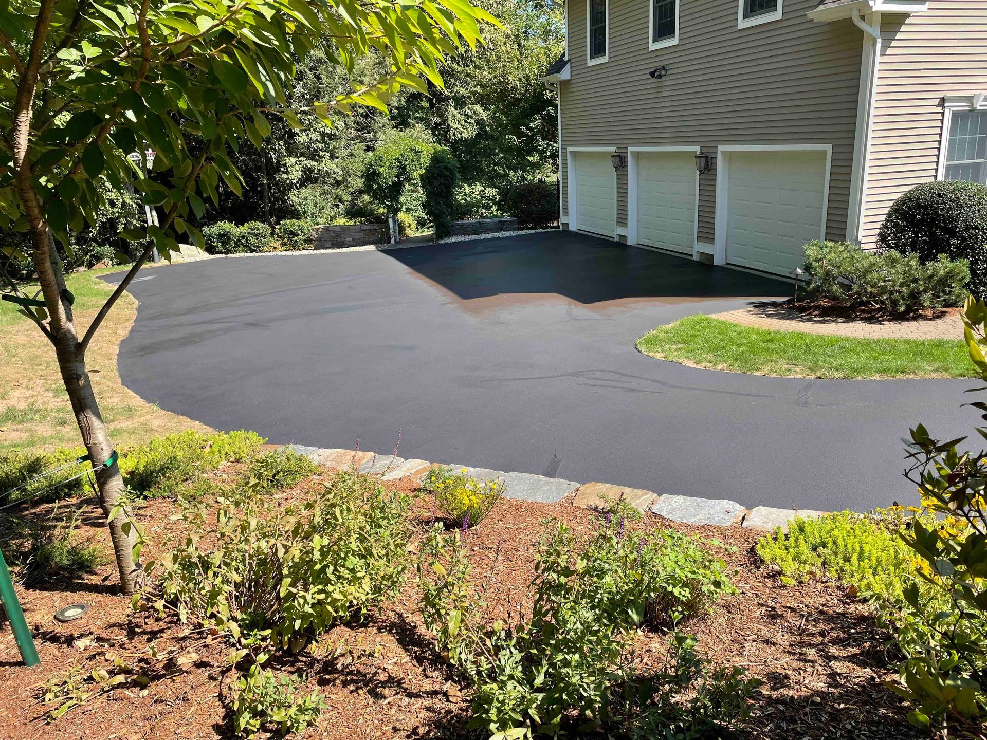 seal coating and crack filling service for residential driveway in west hartford, Connecticut landscape solutions.