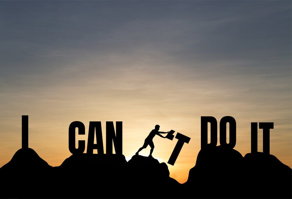 Silhouette of young man change i can't do it to i can do it text on Mountain, sky and sun light background. Business, success, achievement and idea concept.