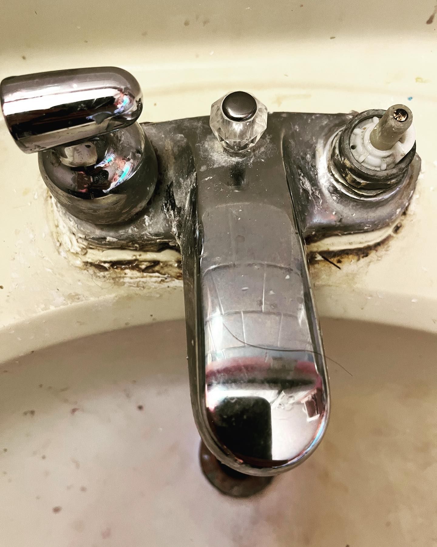 A close up of a faucet in a bathroom sink.