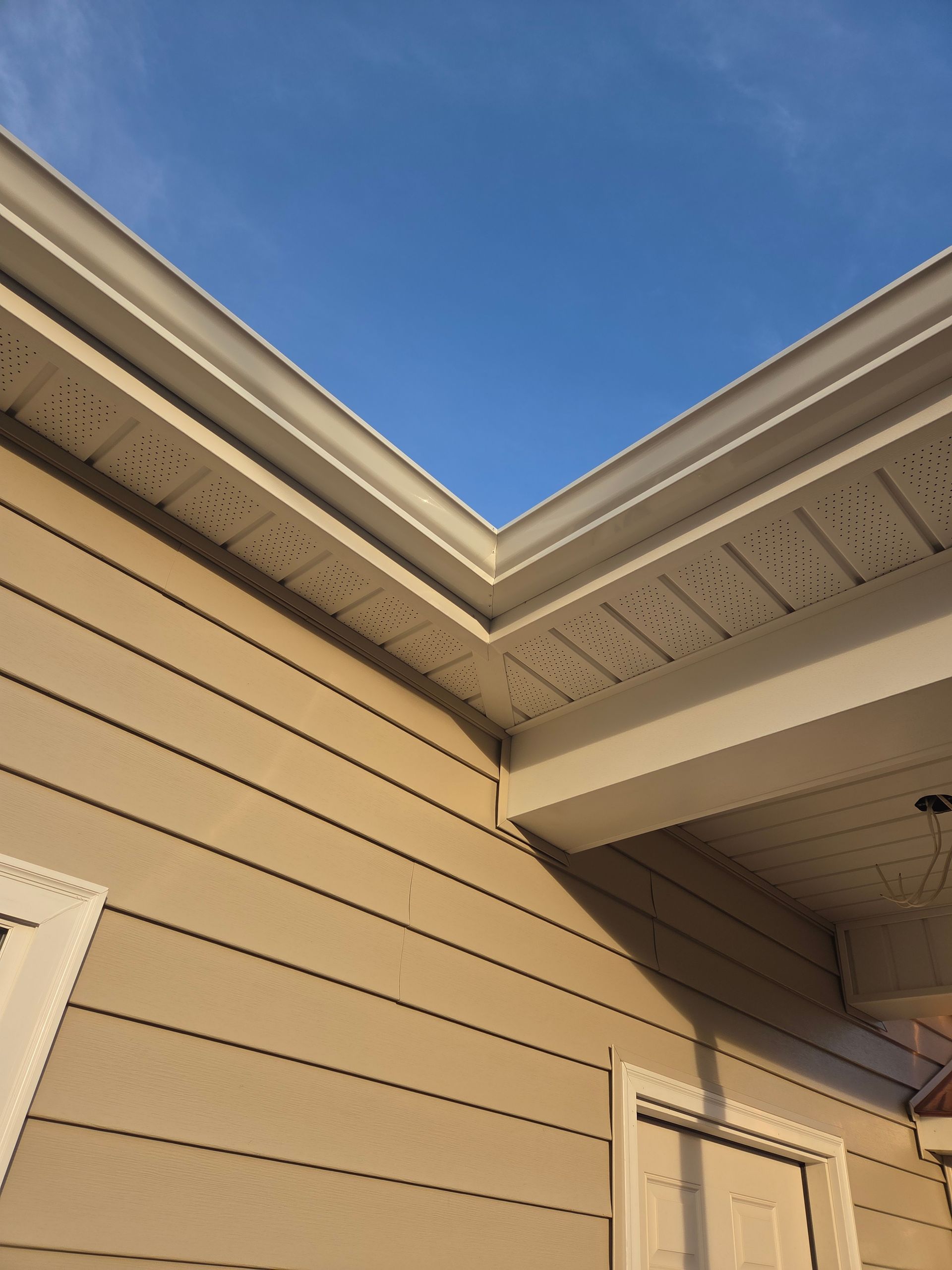 A skilled window cleaning team working diligently to clear grime and dirt from the windows of a tall urban skyscraper.
