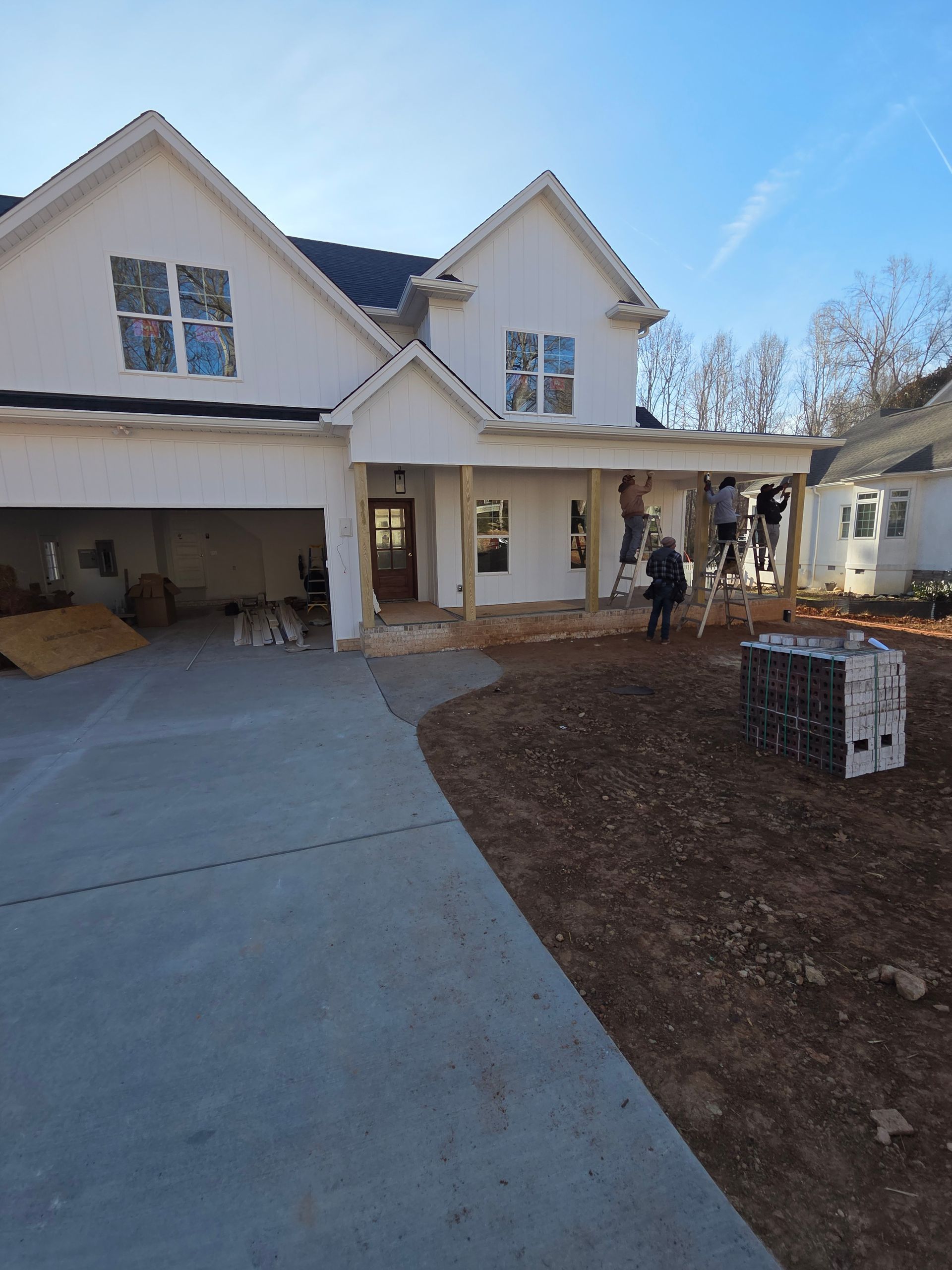 A skilled window cleaning team working diligently to clear grime and dirt from the windows of a tall urban skyscraper.