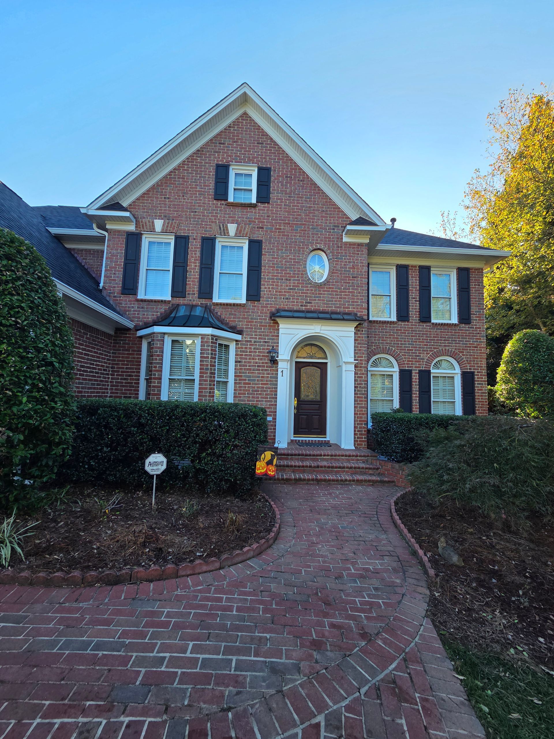A skilled window cleaning team working diligently to clear grime and dirt from the windows of a tall urban skyscraper.