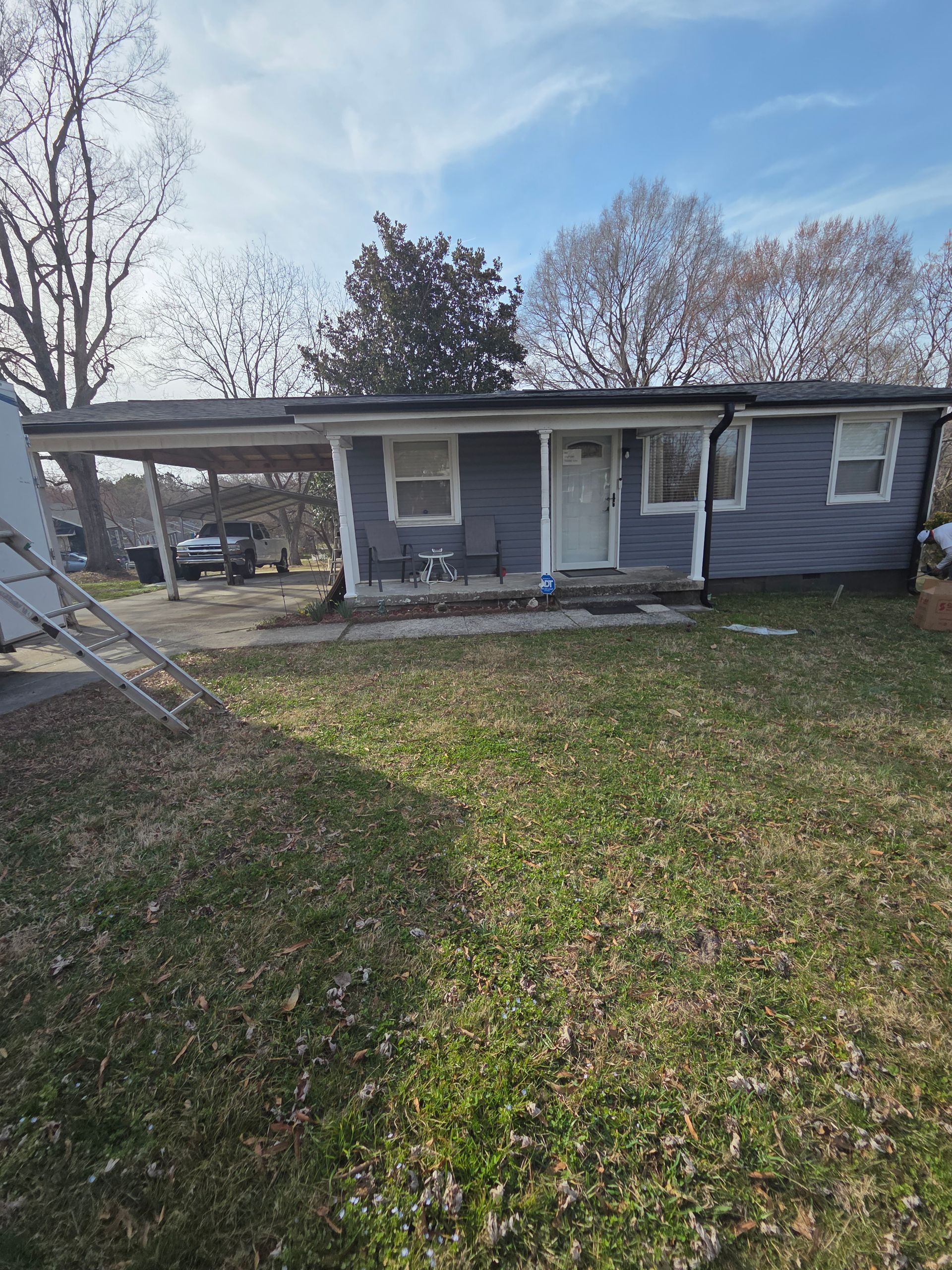 A skilled window cleaning team working diligently to clear grime and dirt from the windows of a tall urban skyscraper.
